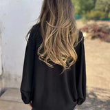 Blusa larga con botones